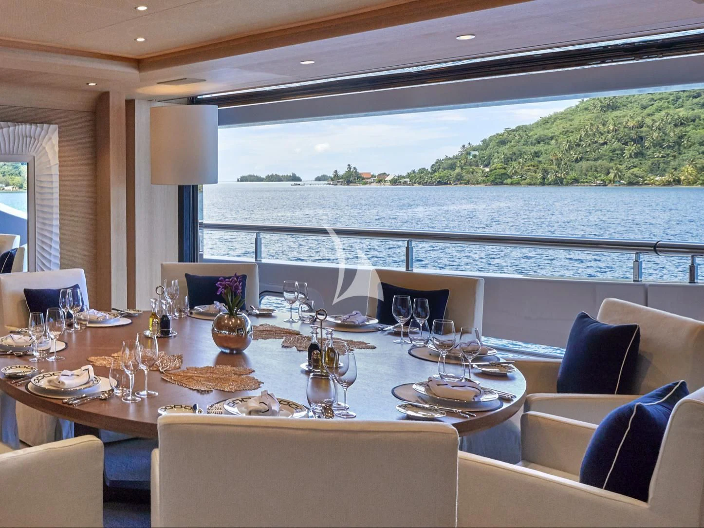 a table set for a dinner aboard IJE Yacht for Sale