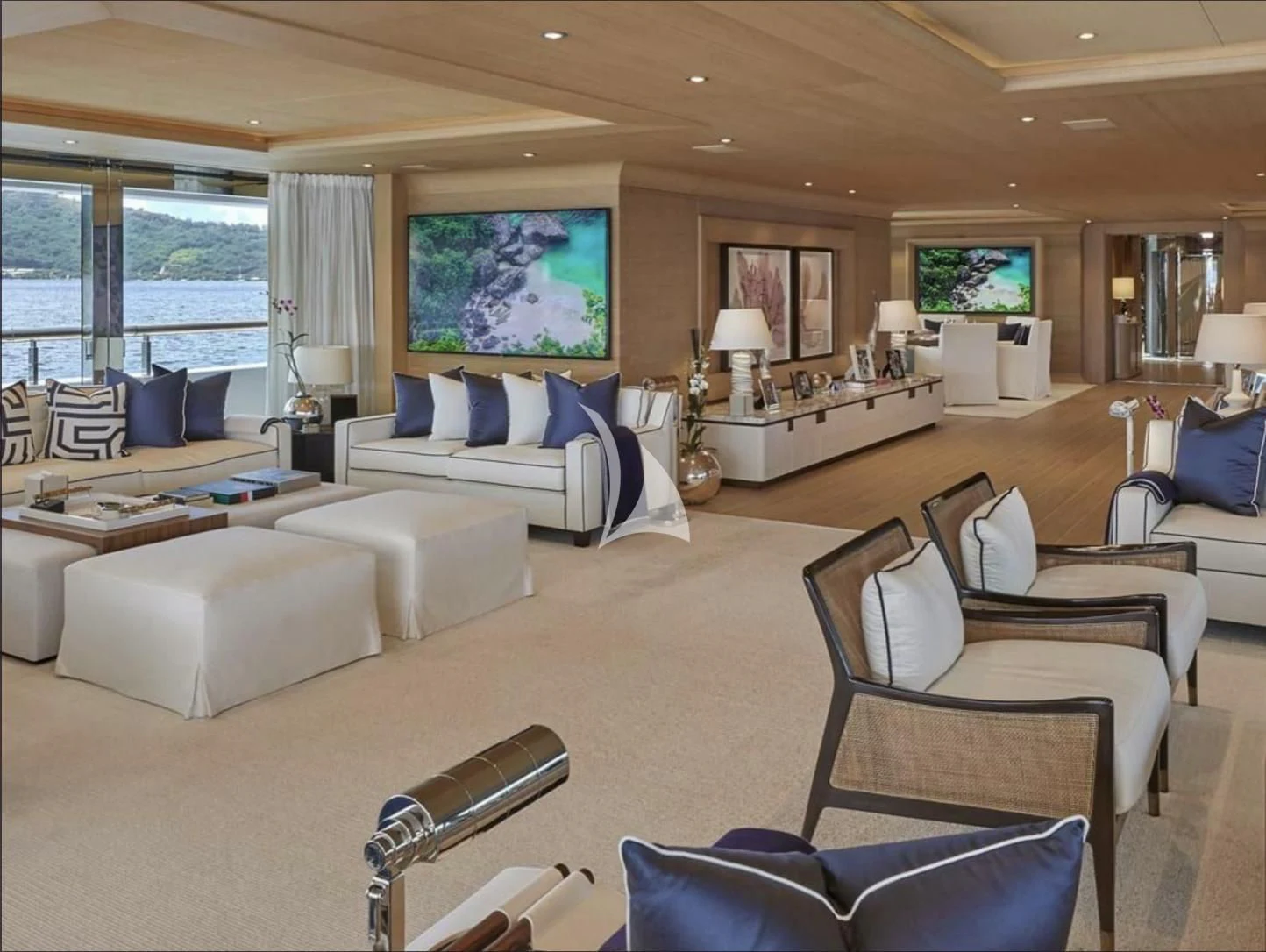 a living room with a large window aboard IJE Yacht for Sale
