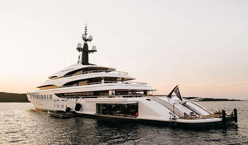 a large white boat on the water aboard IJE Yacht for Sale
