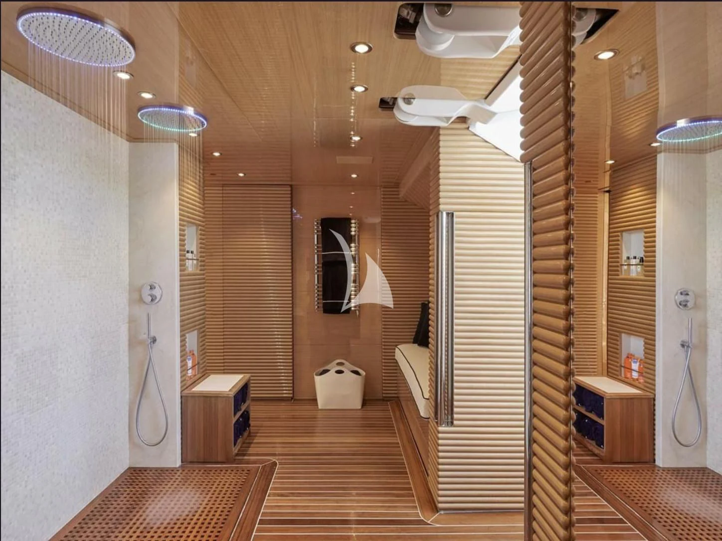 a bathroom with a wood floor aboard IJE Yacht for Sale