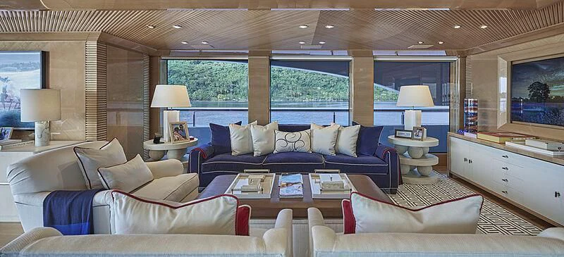 a living room with a large window aboard IJE Yacht for Sale