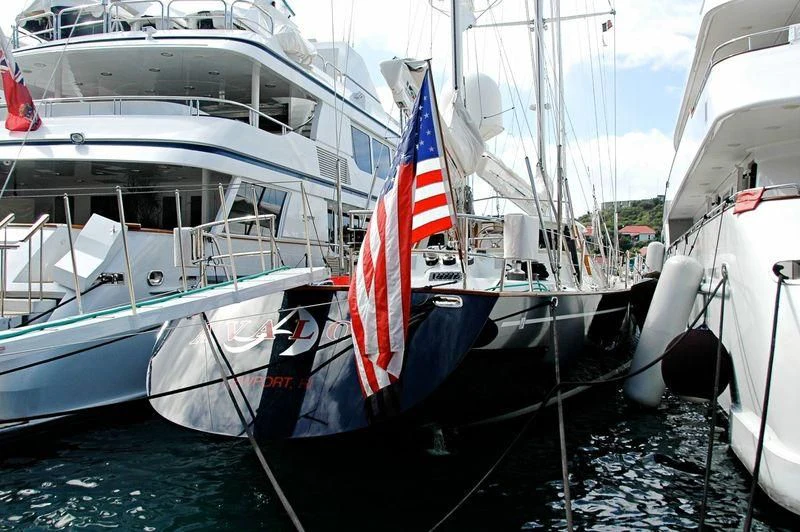 a boat with a flag on it aboard AVALON Yacht for Sale