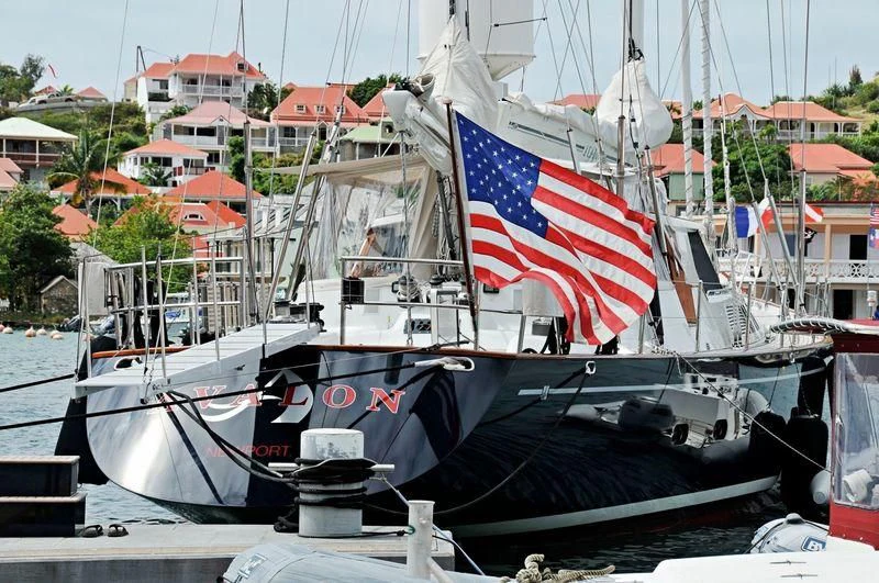 a boat with a flag on it aboard AVALON Yacht for Sale
