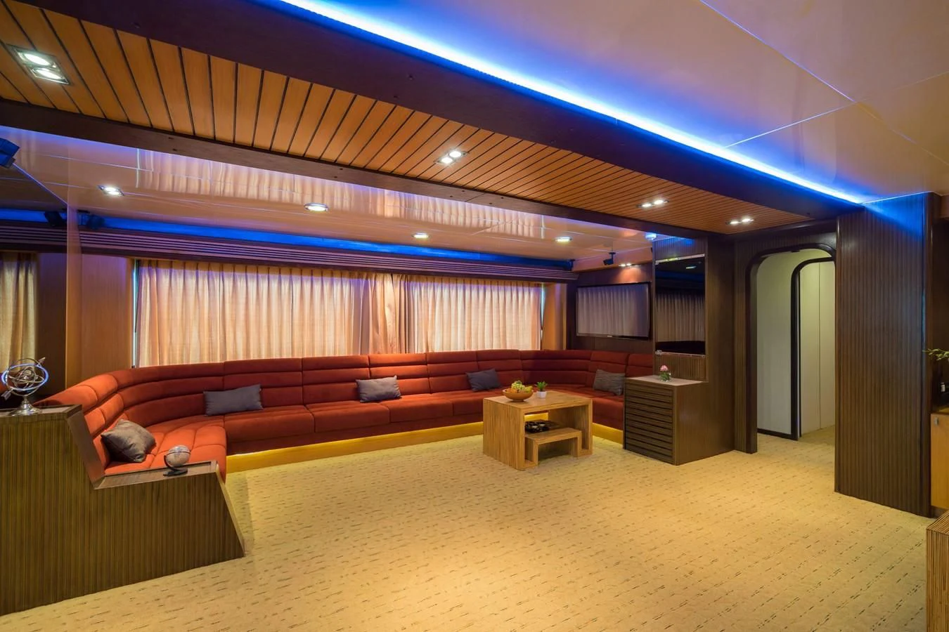 a large room with a couch and a table aboard PHATSARA Yacht for Sale