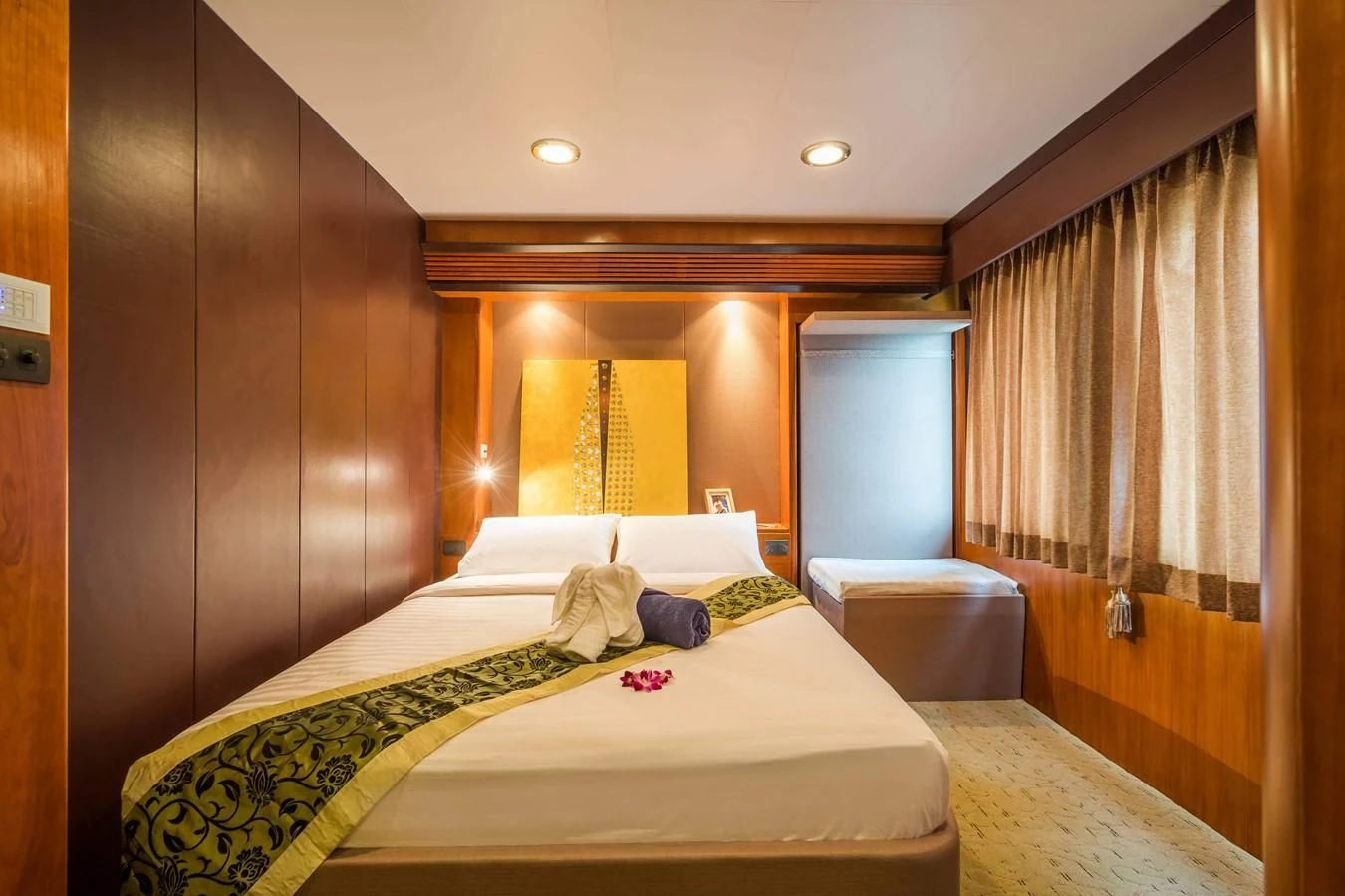 a bed in a room aboard PHATSARA Yacht for Sale