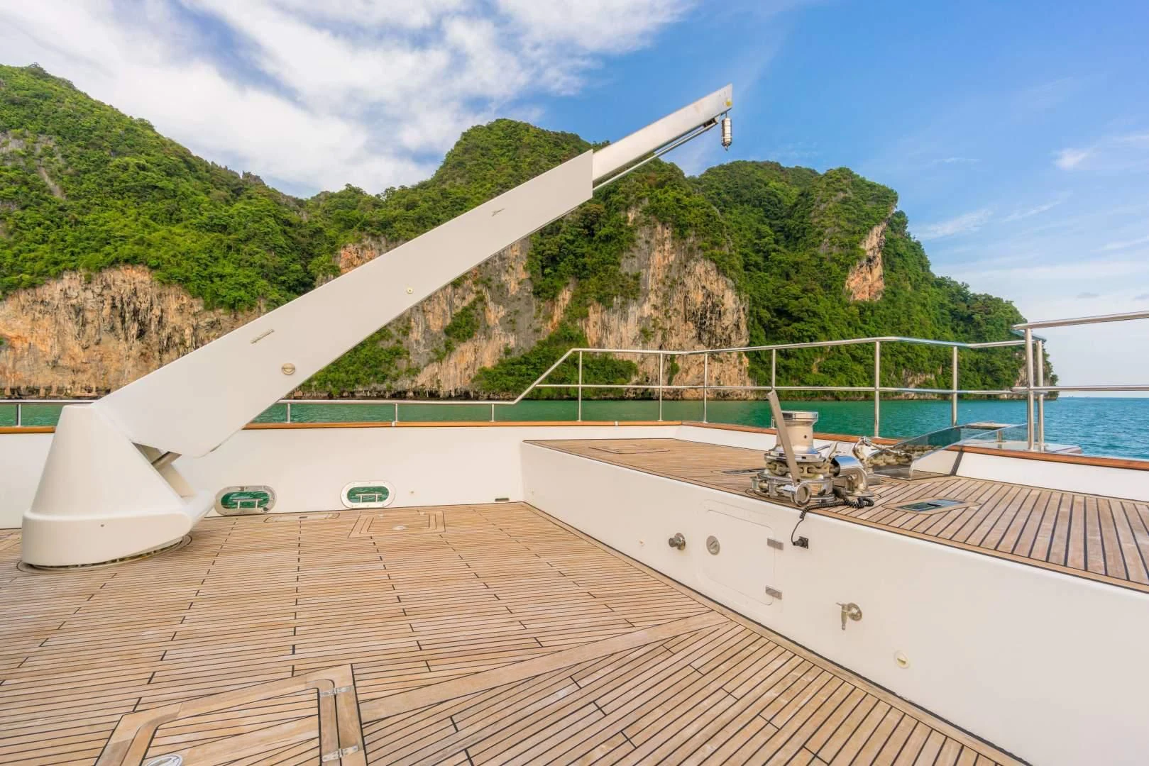 a deck with a large building on it by the water aboard PHATSARA Yacht for Sale