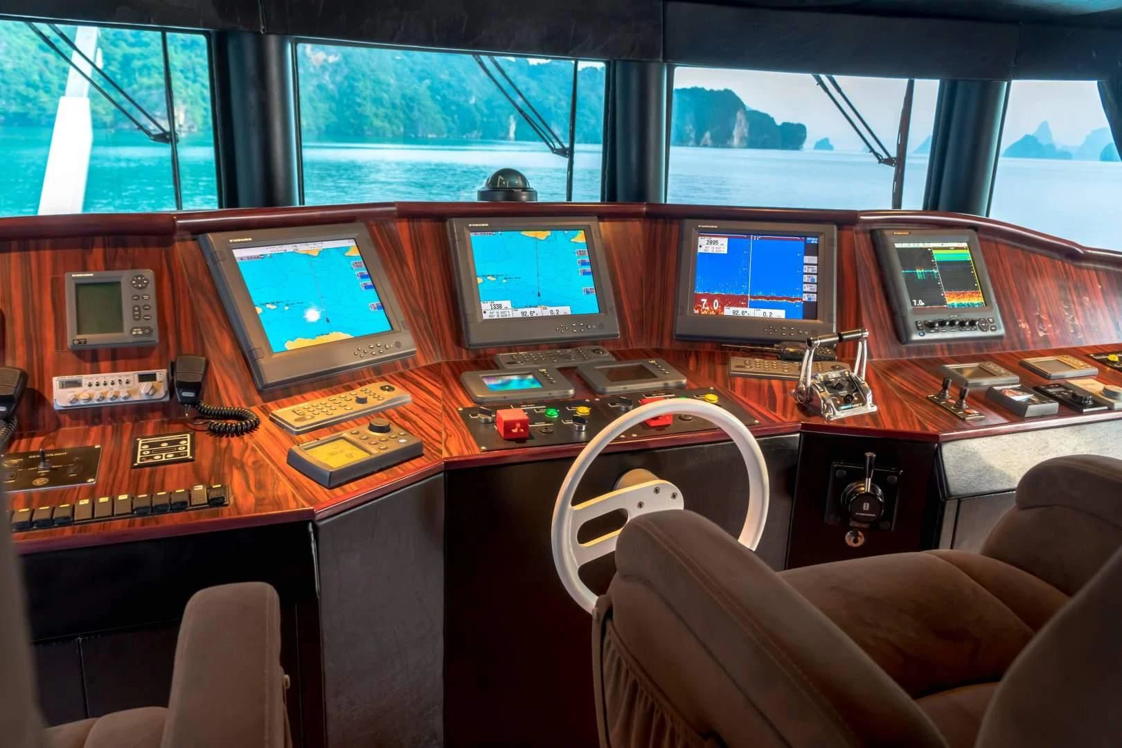 a desk with computers and monitors aboard PHATSARA Yacht for Sale