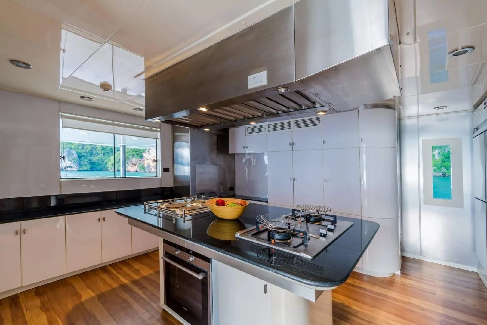 a kitchen with white cabinets aboard PHATSARA Yacht for Sale
