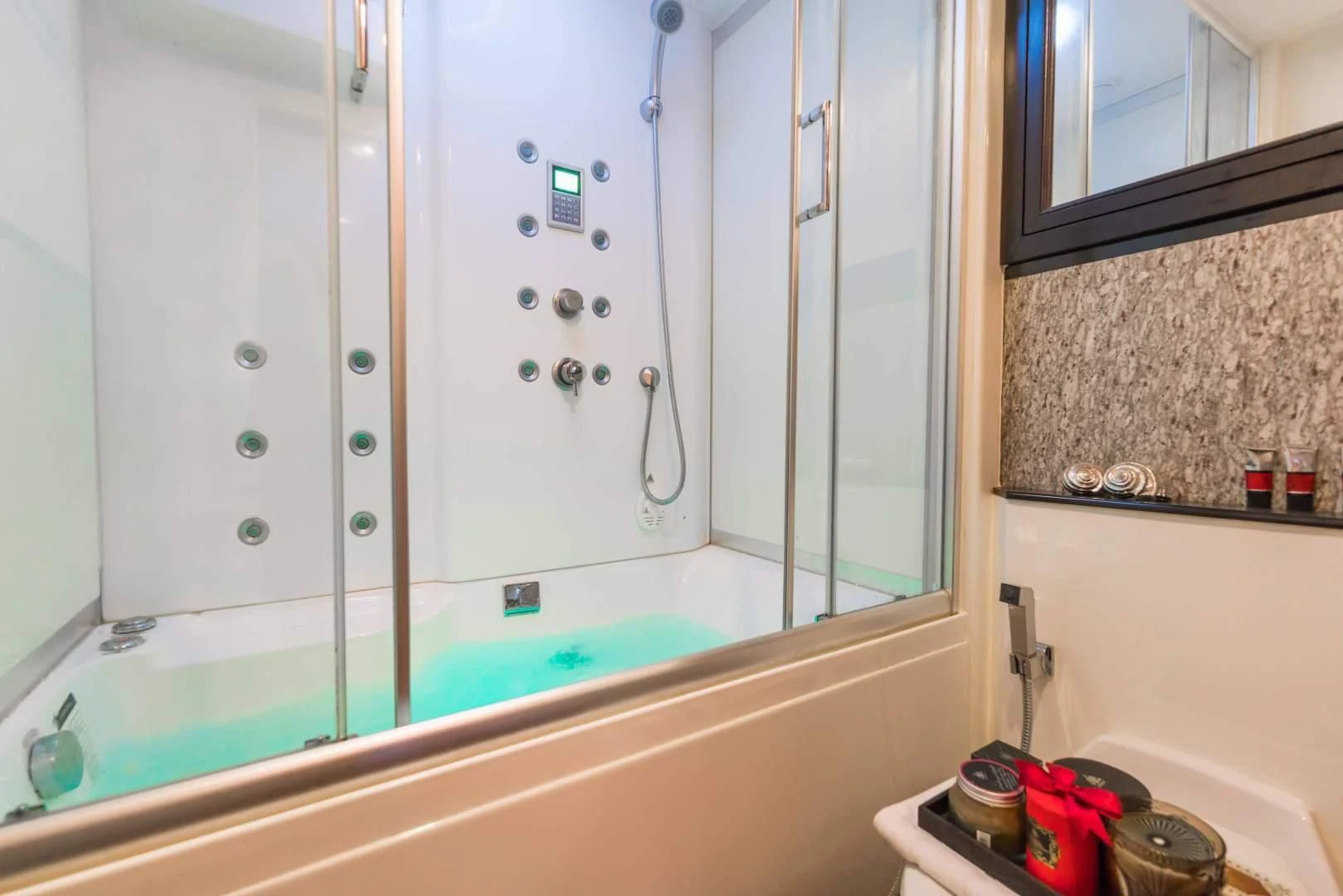 a bathtub with a shower aboard PHATSARA Yacht for Sale