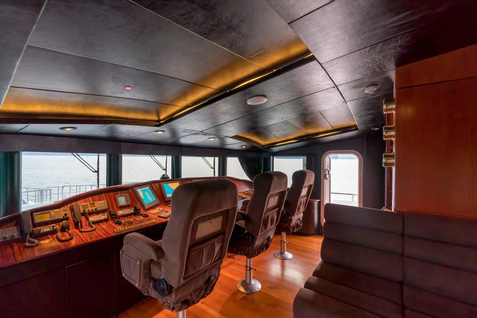 inside of a vehicle with a table and chairs and a couch aboard PHATSARA Yacht for Sale