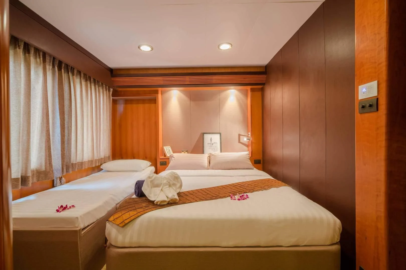 a room with two beds aboard PHATSARA Yacht for Sale