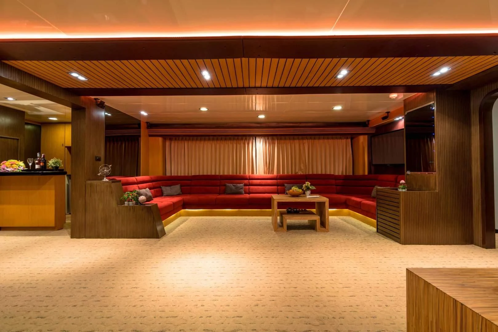 a large room with a couch and a table aboard PHATSARA Yacht for Sale