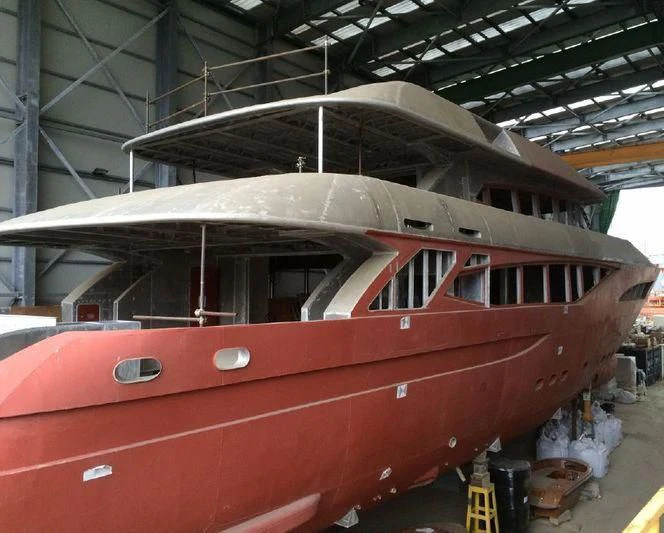 a large red boat in a warehouse aboard COLLEZIONE 40 / 347 Yacht for Sale