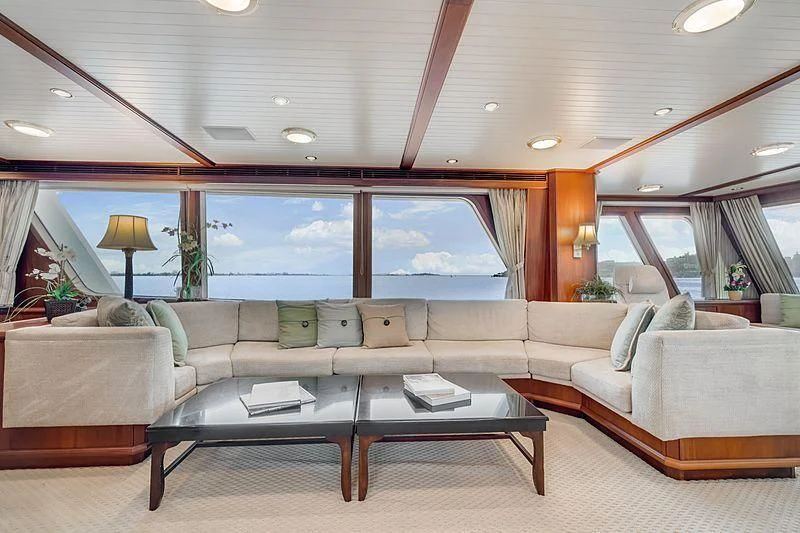 a living room with a large window aboard NIRVANA Yacht for Sale