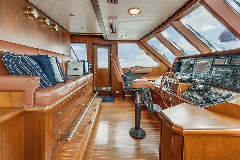 a room with a couch and a table aboard NIRVANA Yacht for Sale