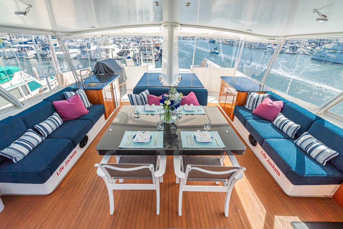 a room with a table and chairs aboard NIRVANA Yacht for Sale