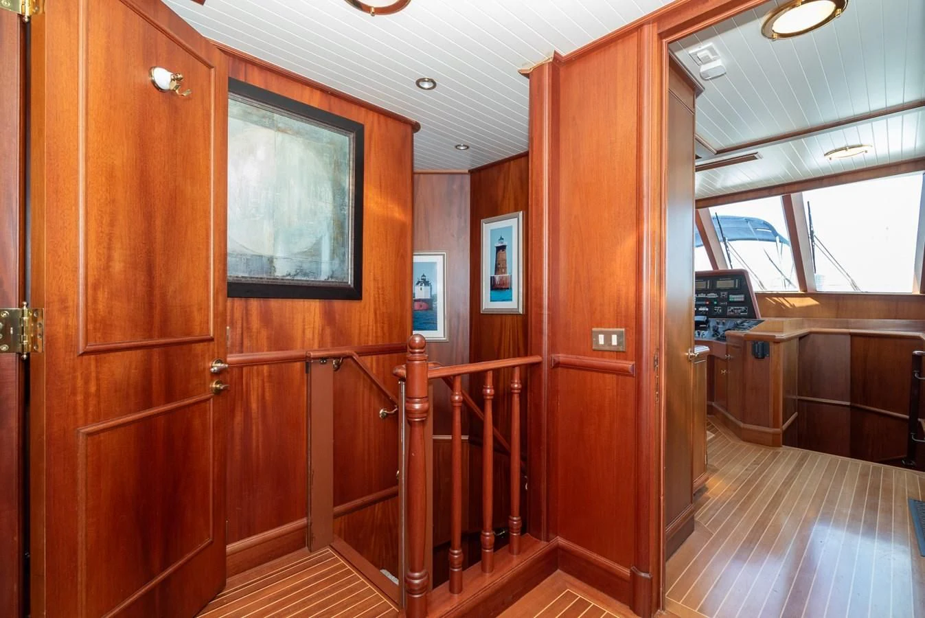 a wooden cabin with a wood door aboard NIRVANA Yacht for Sale