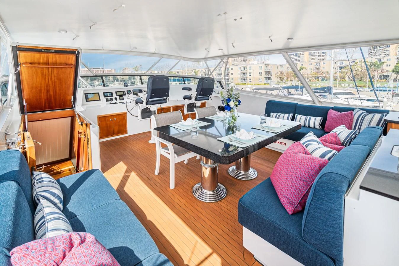 a living room with a couch and a table aboard NIRVANA Yacht for Sale
