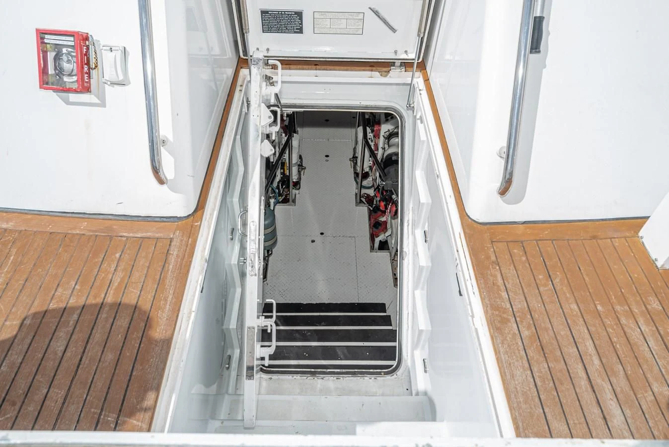 a hallway with a door and a vent aboard NIRVANA Yacht for Sale