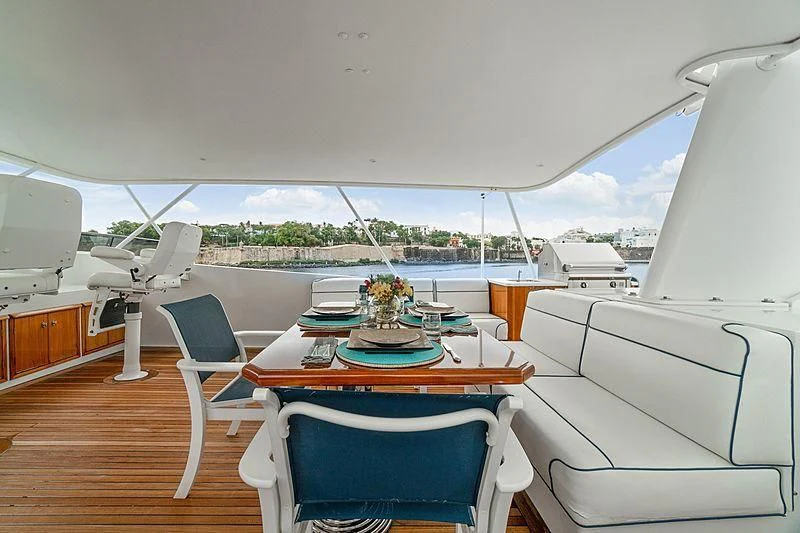 a room with a table and chairs aboard NIRVANA Yacht for Sale