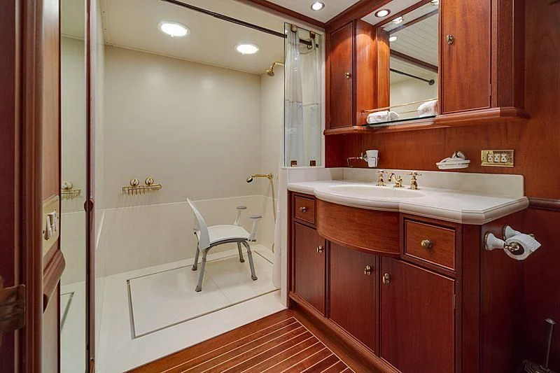 a bathroom with a sink and cabinets aboard NIRVANA Yacht for Sale