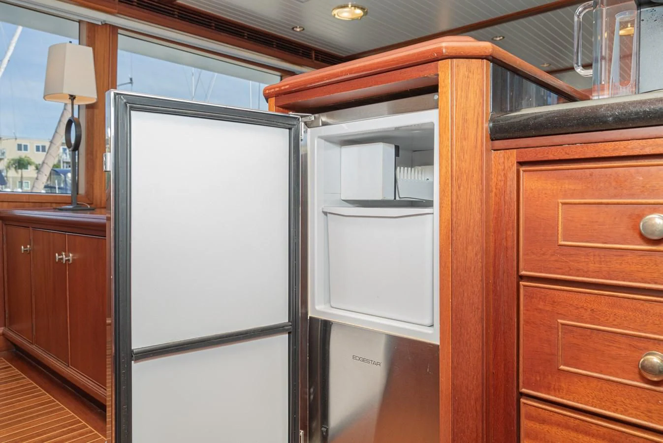 a room with wooden cabinets aboard NIRVANA Yacht for Sale