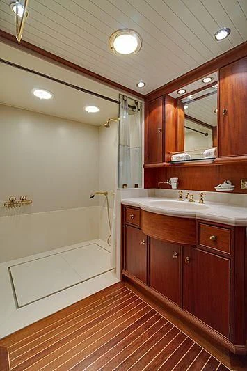 a bathroom with a large mirror aboard NIRVANA Yacht for Sale