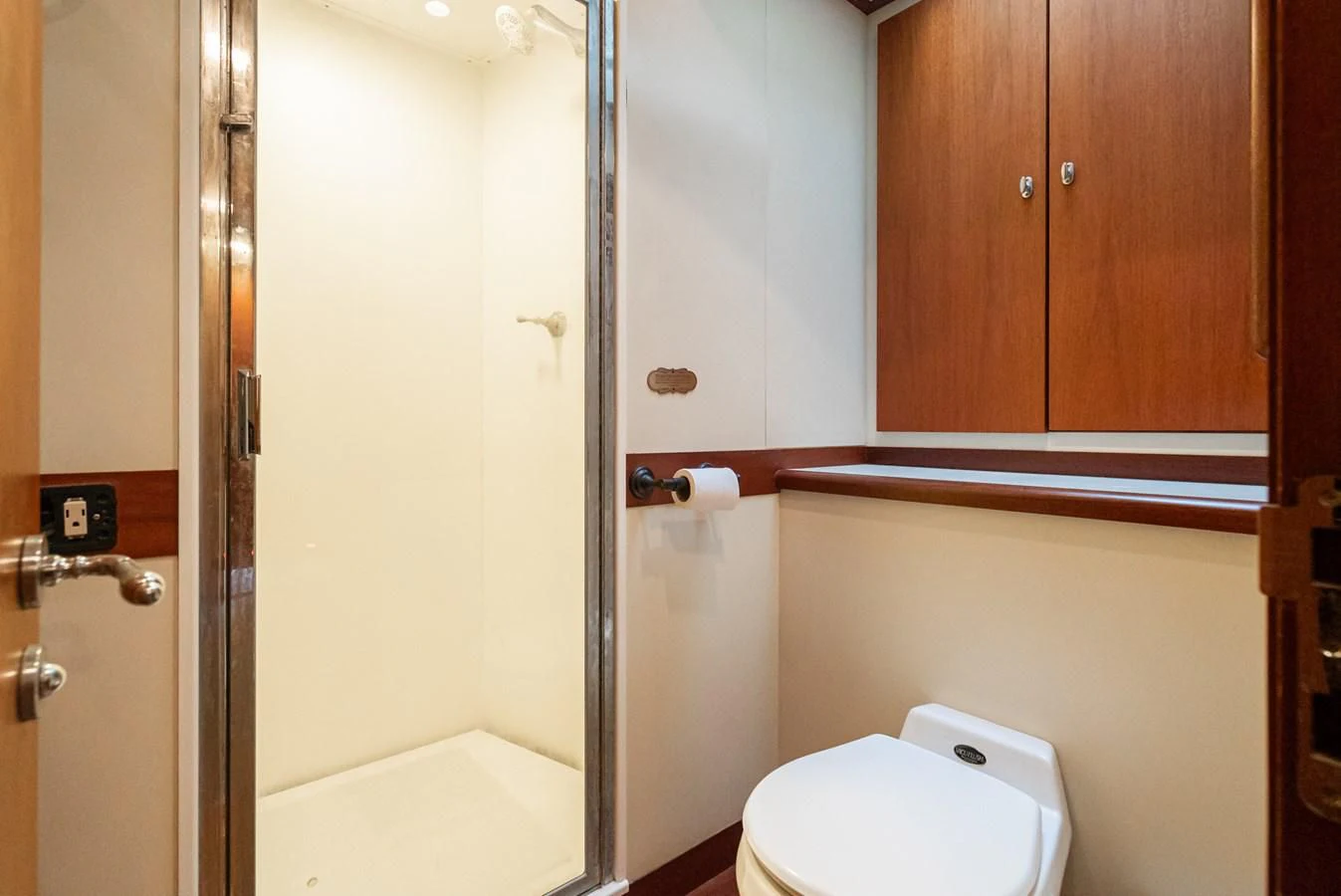 a bathroom with a toilet and a shower aboard NIRVANA Yacht for Sale