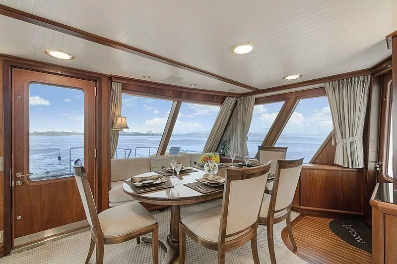 a dining table on a deck aboard NIRVANA Yacht for Sale
