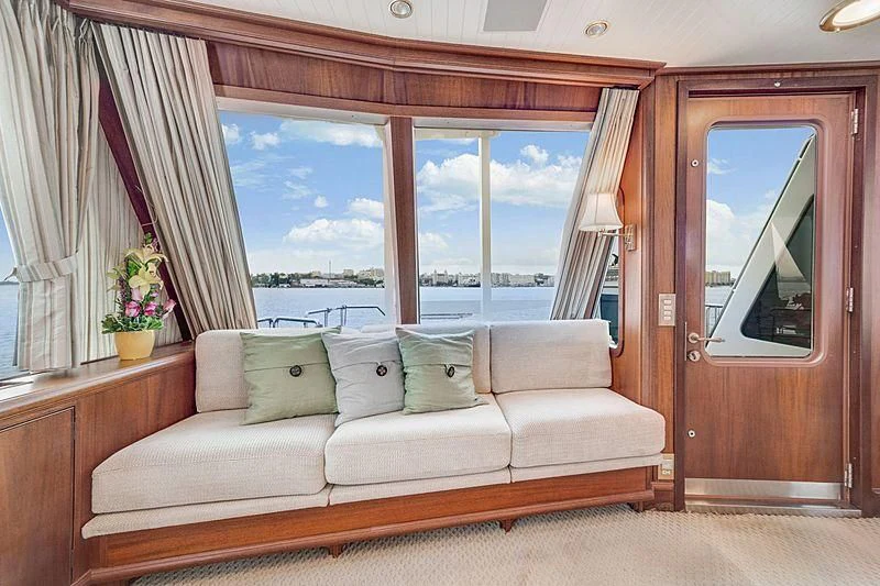 a couch in a room aboard NIRVANA Yacht for Sale