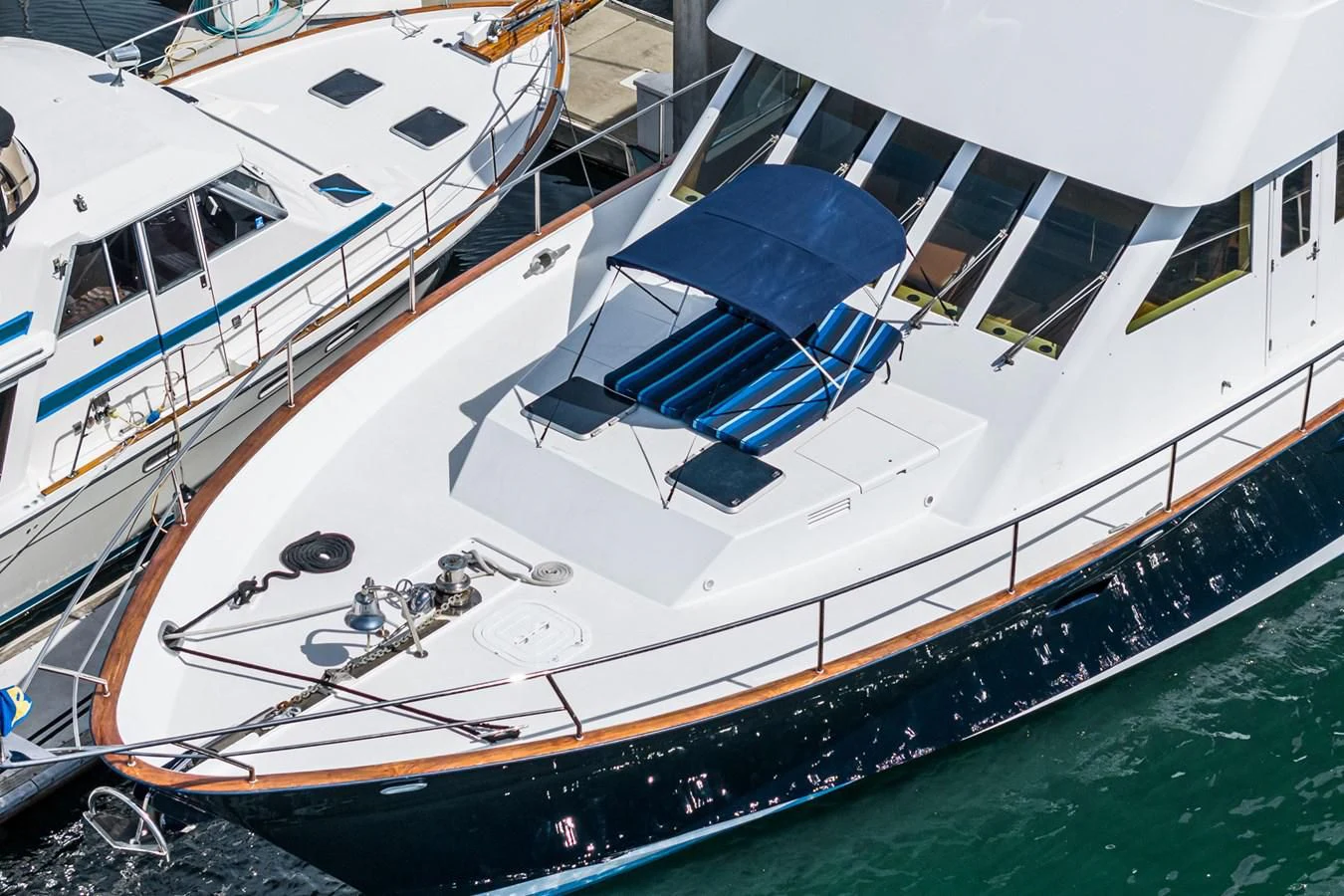several boats docked at a pier aboard NIRVANA Yacht for Sale