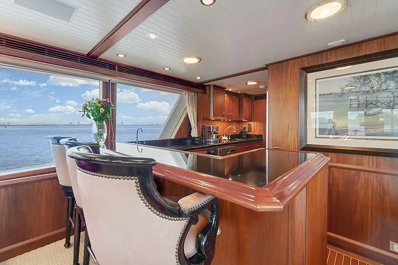 a kitchen with a large window aboard NIRVANA Yacht for Sale