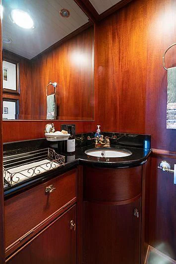 a bathroom with a sink and a mirror aboard NIRVANA Yacht for Sale