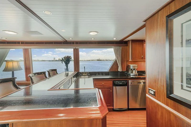 a kitchen with a large window aboard NIRVANA Yacht for Sale