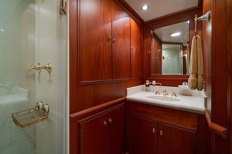 a bathroom with a sink and mirror aboard NIRVANA Yacht for Sale