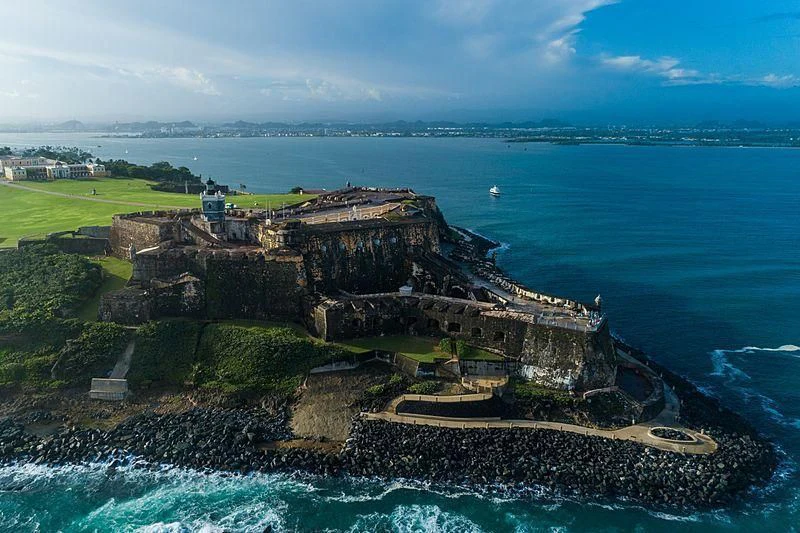 a rocky island with a body of water in the background aboard NIRVANA Yacht for Sale