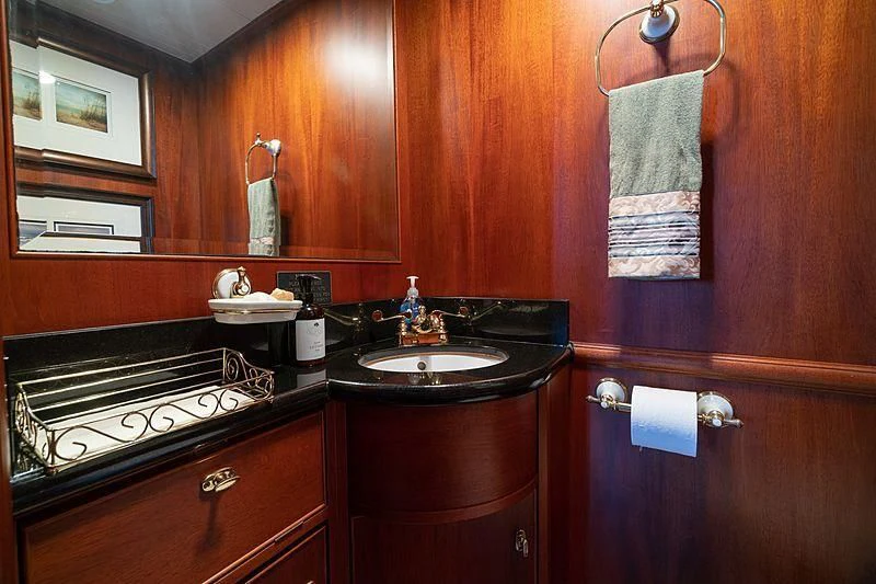 a bathroom with a sink and a mirror aboard NIRVANA Yacht for Sale