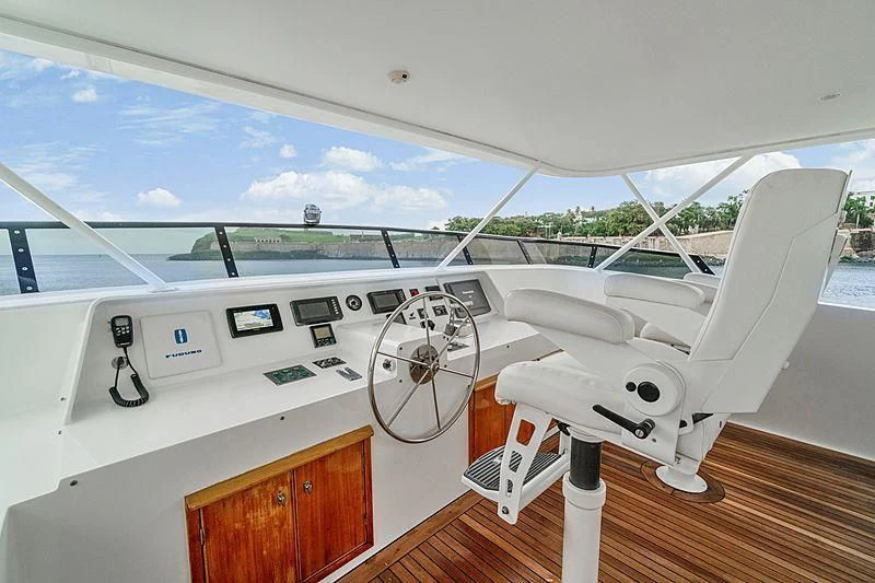 a white satellite dish on a wooden table aboard NIRVANA Yacht for Sale