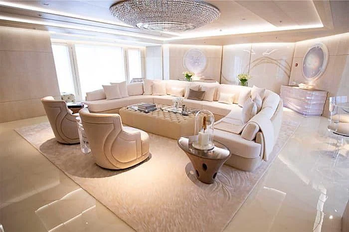 a living room with a large chandelier aboard BRAVO EUGENIA Yacht for Sale