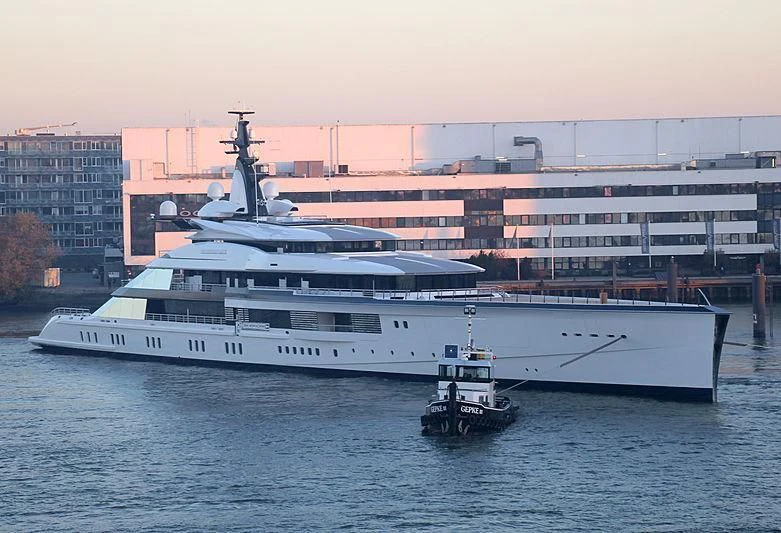 a large white boat next to a smaller boat in the water aboard BRAVO EUGENIA Yacht for Sale