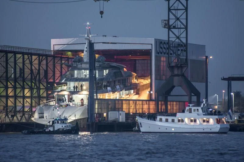 a large ship docked next to a large ship aboard BRAVO EUGENIA Yacht for Sale