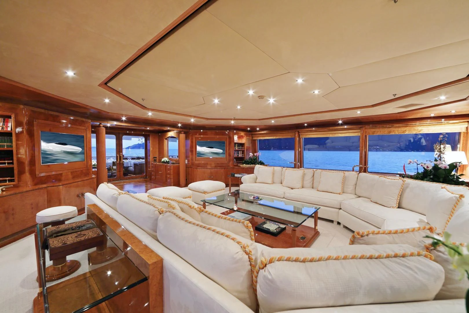a living room with a large window aboard AQUA MARE Yacht for Sale