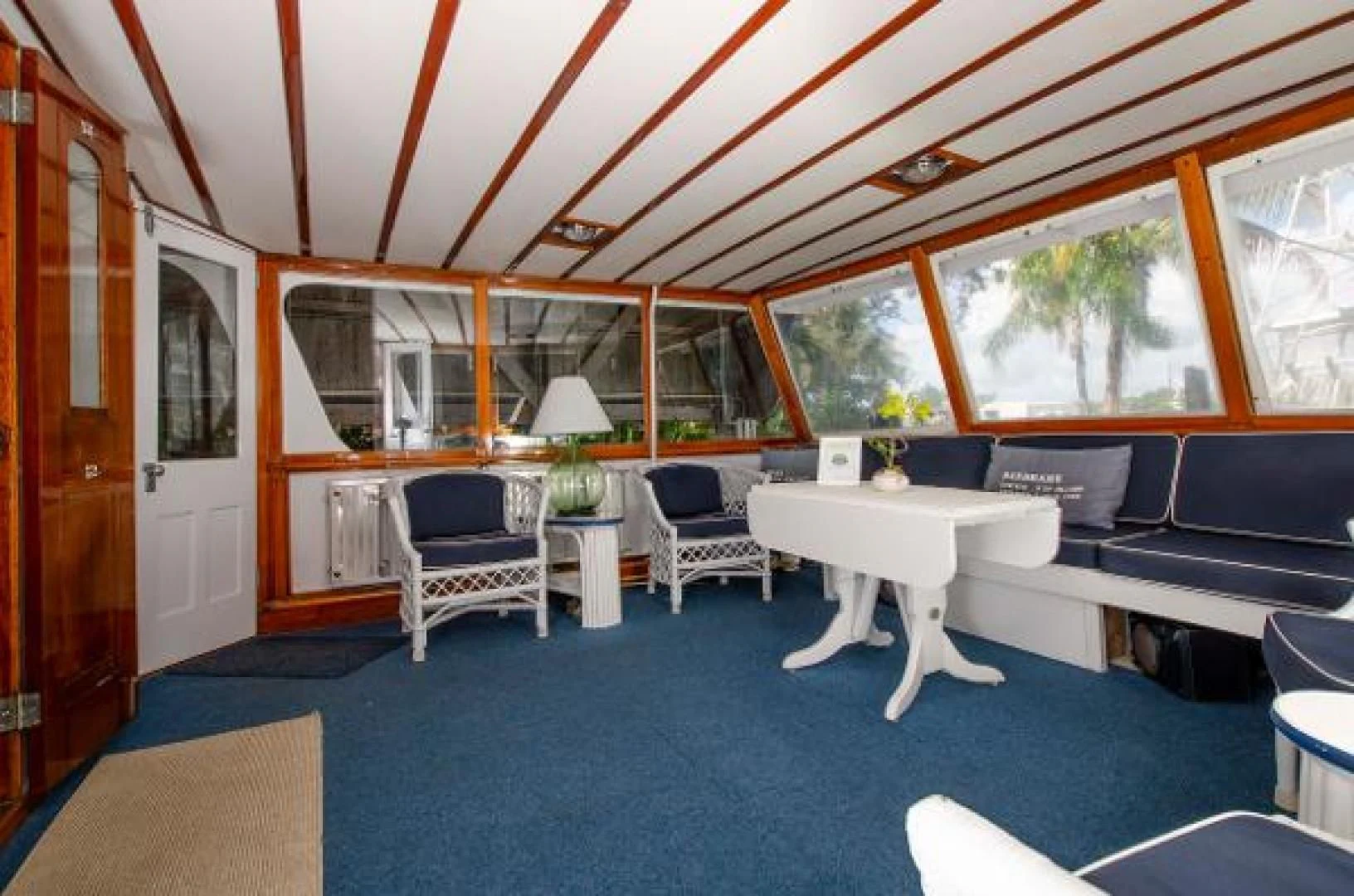 a room with a couch and a table aboard LIBERTY LOVE Yacht for Sale