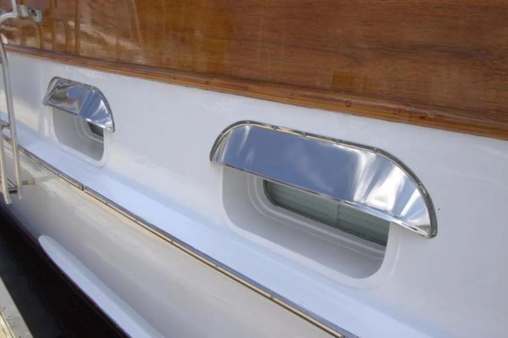 a silver and silver faucet on a white door aboard LIBERTY LOVE Yacht for Sale