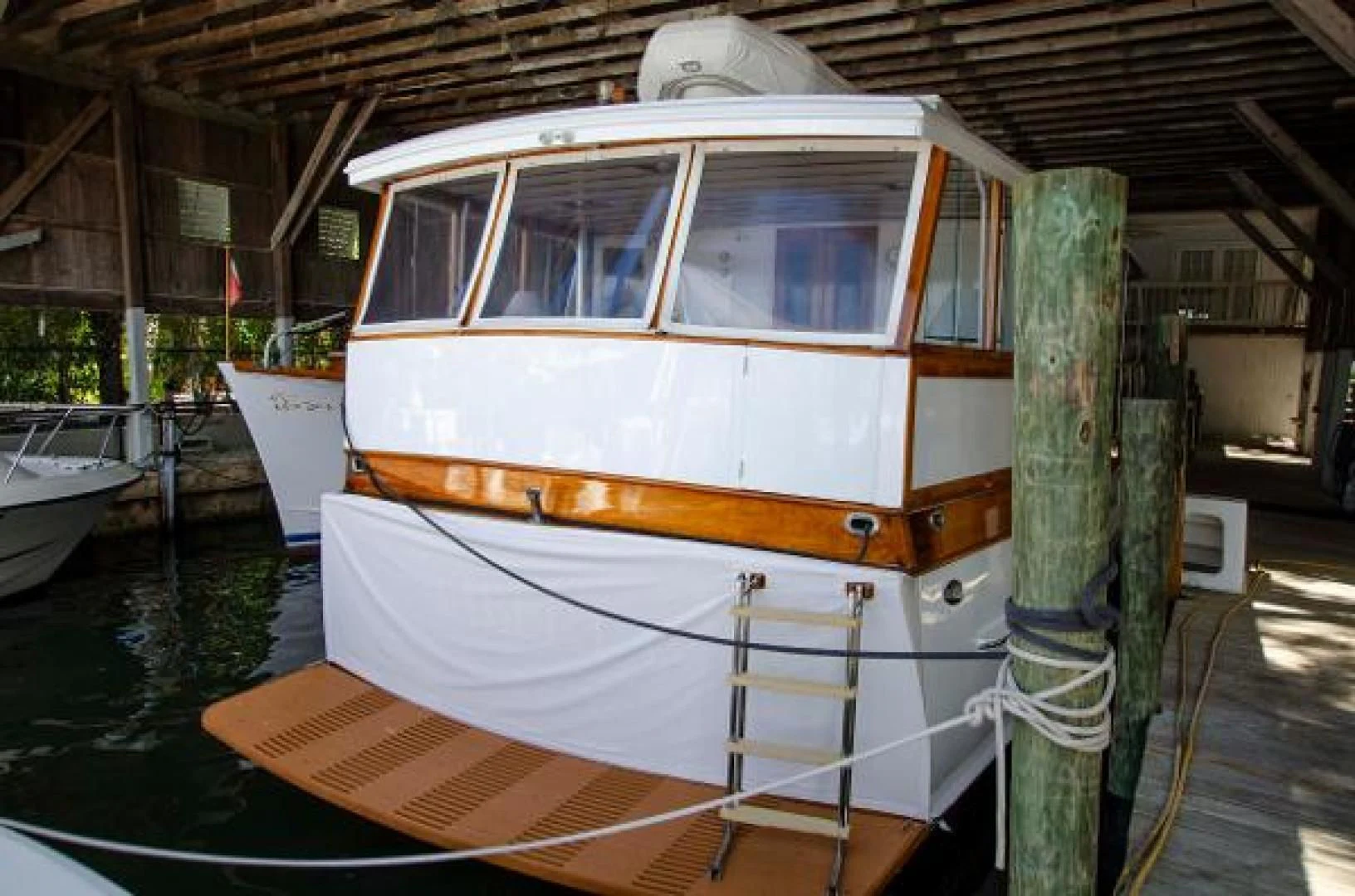 a boat docked in a harbor aboard LIBERTY LOVE Yacht for Sale