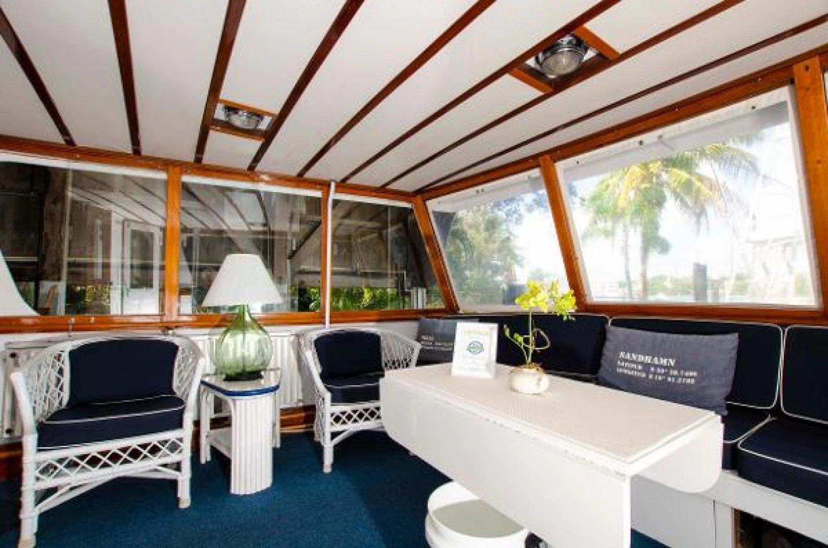 a room with a table and chairs aboard LIBERTY LOVE Yacht for Sale