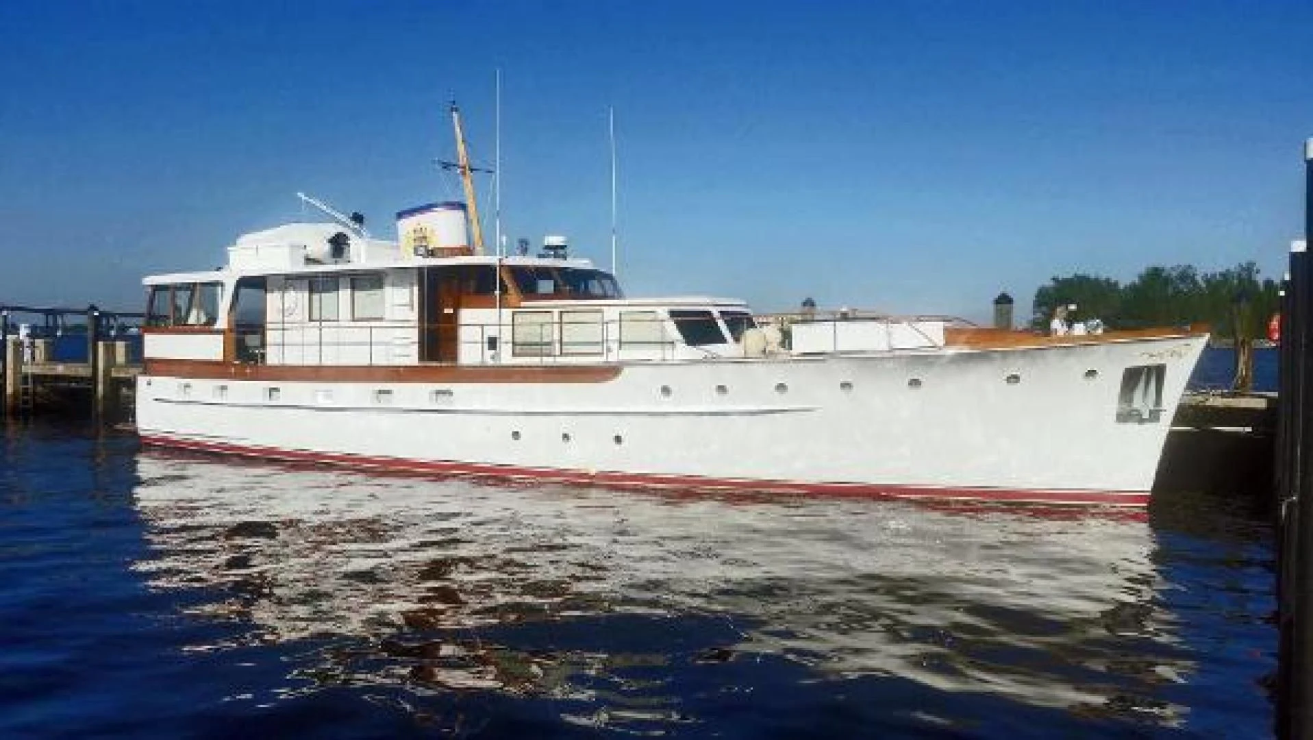 a large white boat on the water aboard LIBERTY LOVE Yacht for Sale
