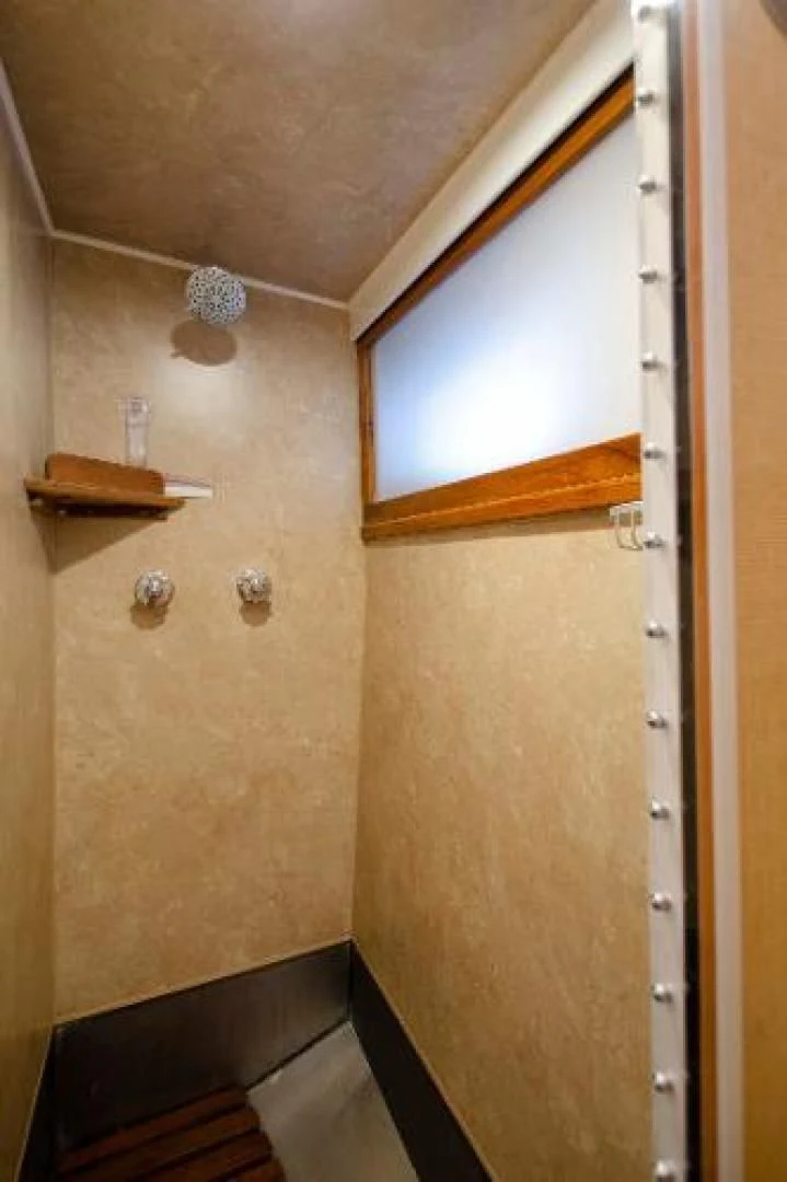 a door with a light on the wall aboard LIBERTY LOVE Yacht for Sale
