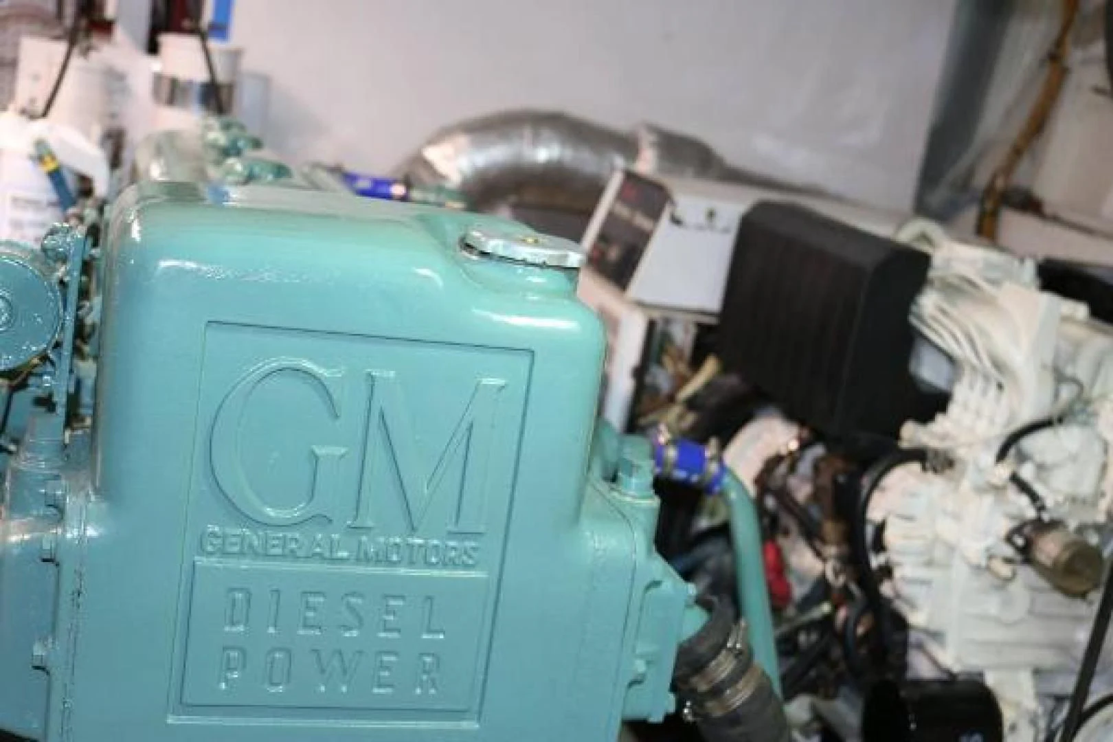 a blue suitcase with a label aboard LIBERTY LOVE Yacht for Sale
