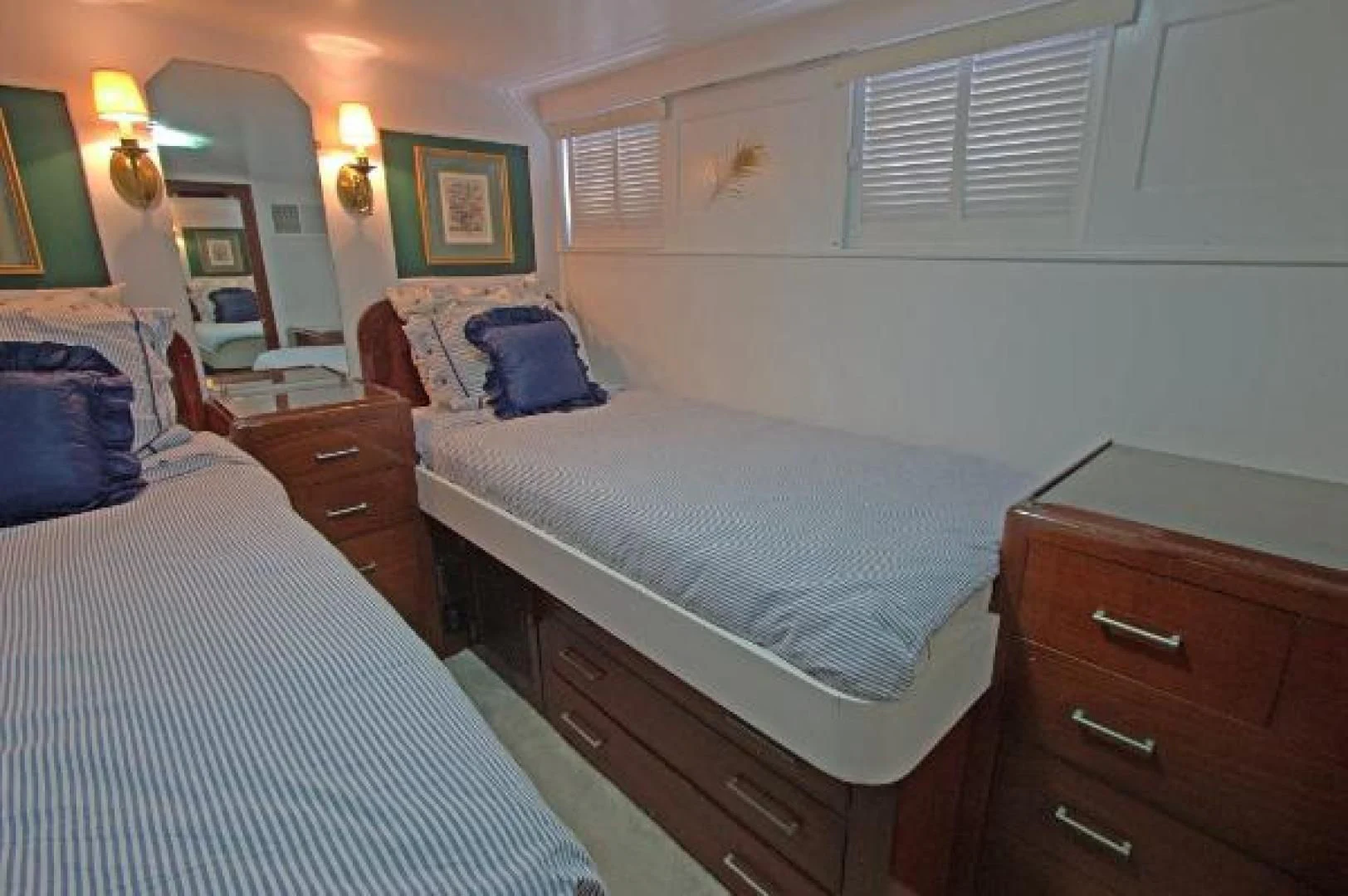 a bedroom with two beds aboard LIBERTY LOVE Yacht for Sale